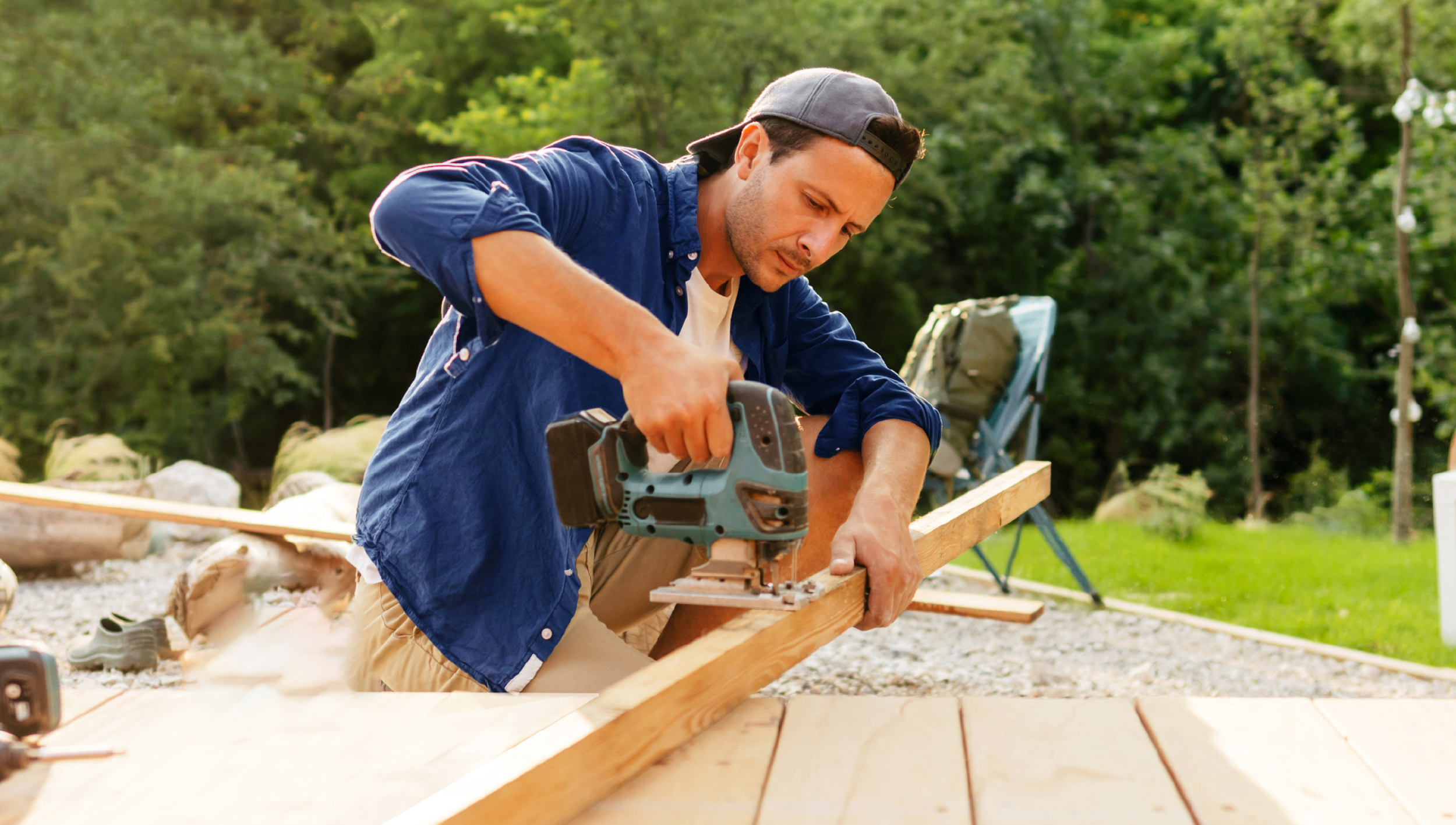 man building new backyard deck