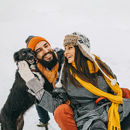 Happy Couple outside with dog