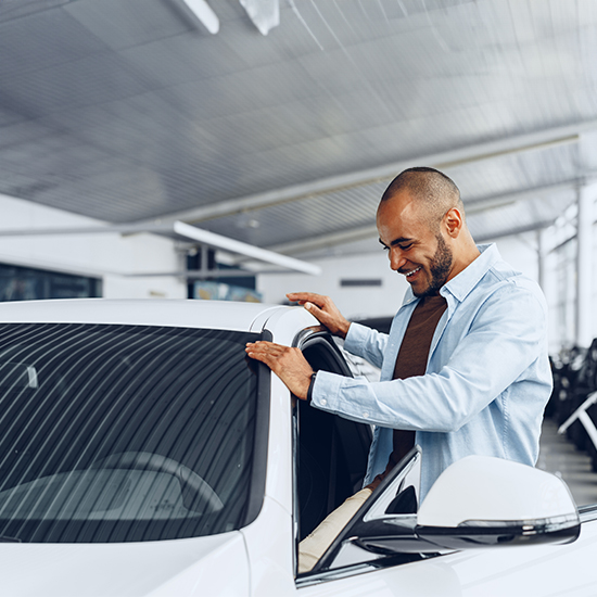 Man looking at car