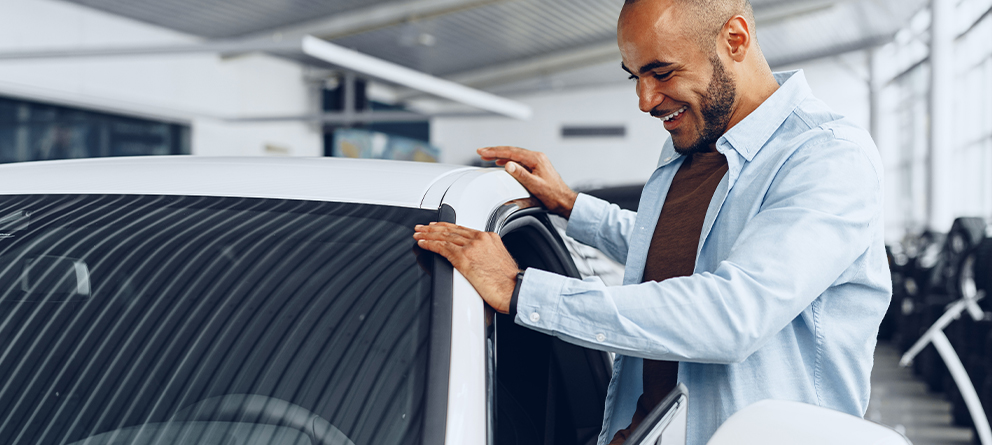 Man looking at car