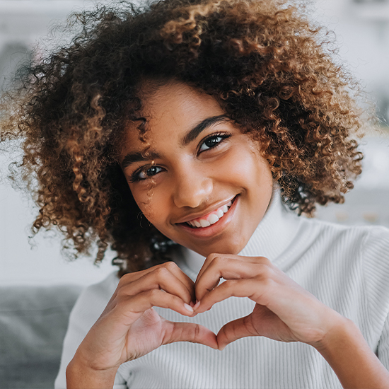 Woman making a heart sign