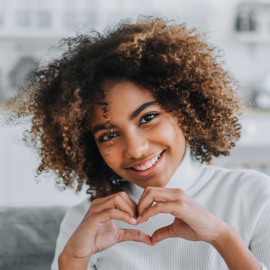 Woman making a heart sign