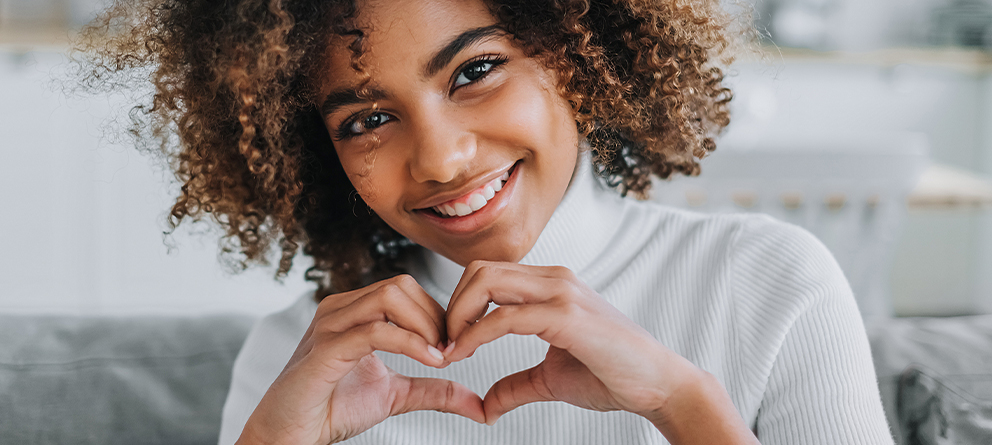 Woman making a heart sign