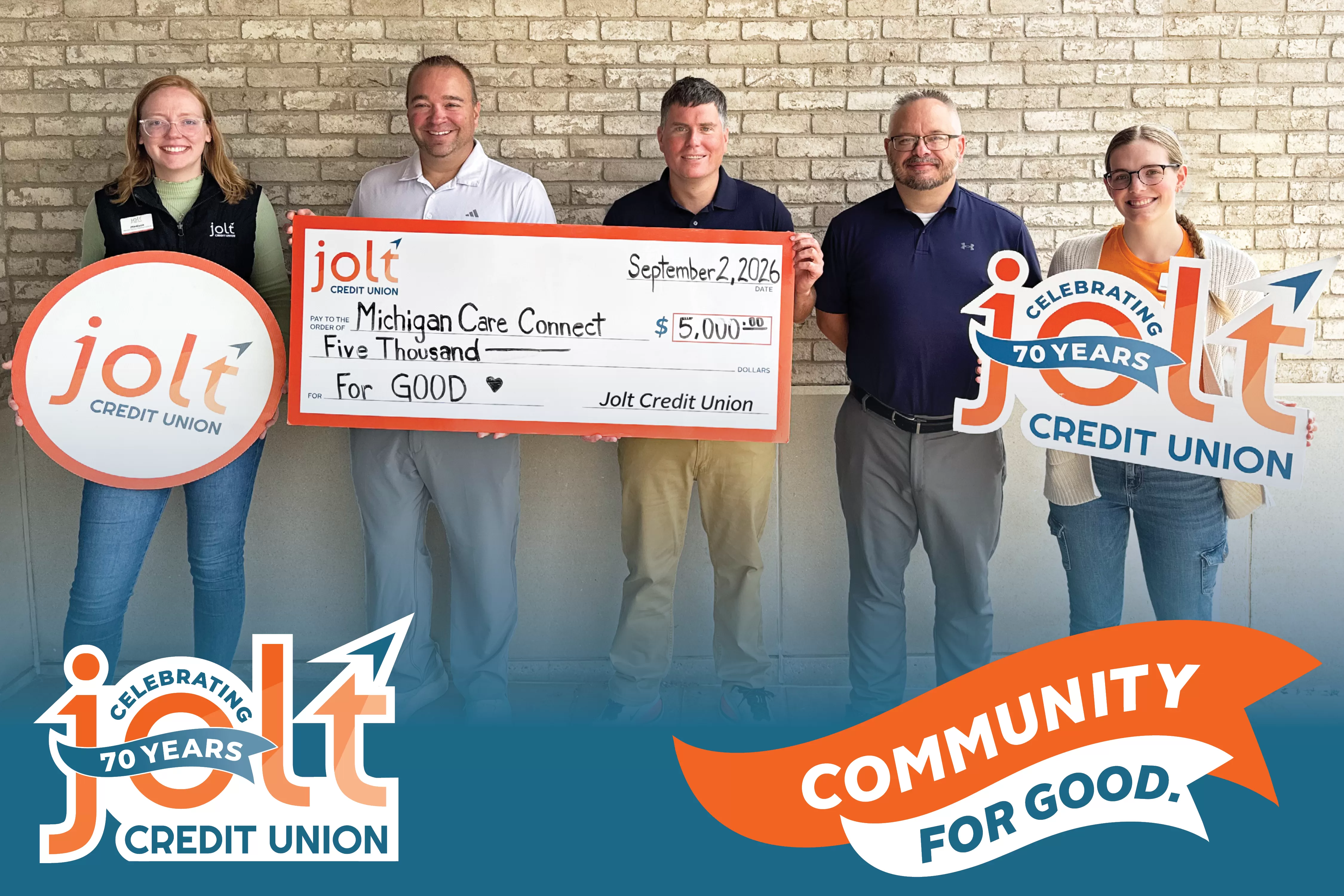 Jolt Credit Union Employees presenting a $5,000 check to Michigan Care Connect as part of their "For Good" initiative.