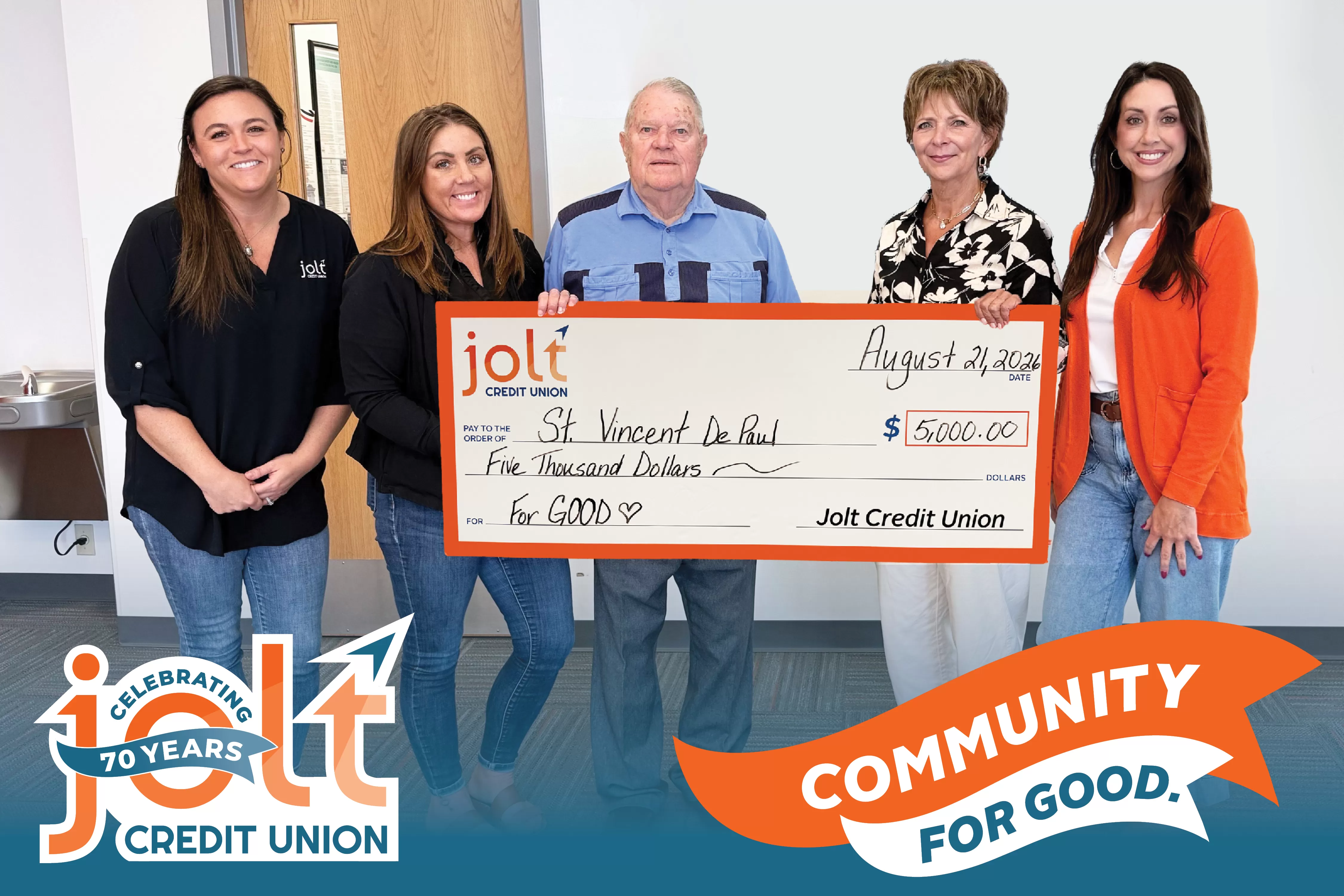 Jolt Credit Union presents a check for $5,000 to the society of St. Vincent De Paul.
