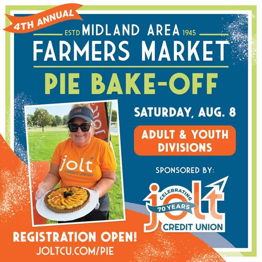 Jolt Credit Union employee holding a pie from last year's Pie Bake-Off competition